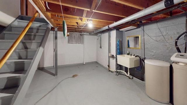 507 Hawthorne St, Albert Lea, MN 56007 - unfinished below grade area featuring a water softener and stairs