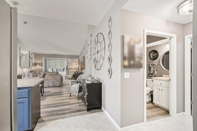 1021 18th Ave SE, Forest Lake, MN 55025 - hall with light tile patterned floors and baseboards