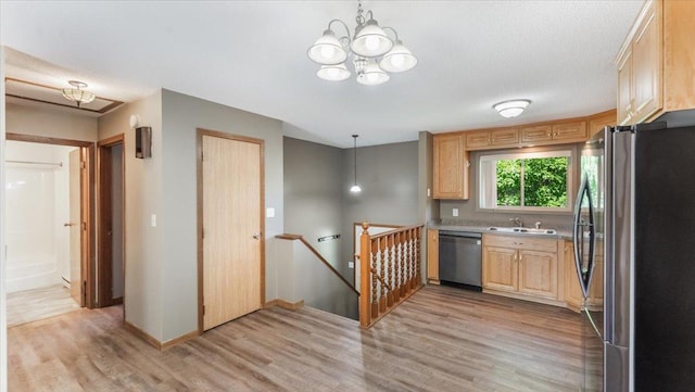 112 9th Ave SE, Saint Joseph, MN 56374 - kitchen featuring appliances with stainless steel finishes, a chandelier, light wood finished floors, light brown cabinets, and light countertops