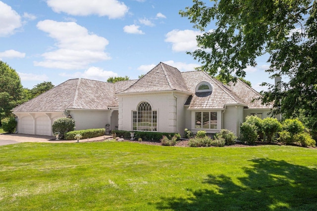 2255 French Creek Cir, Orono, MN 55391 - french country home featuring brick siding, a garage, a front yard, and concrete driveway
