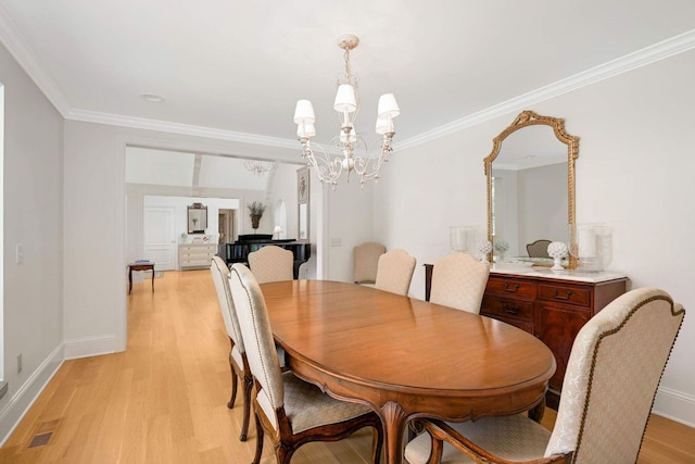 2255 French Creek Cir, Orono, MN 55391 - dining room with a chandelier, light wood-style floors, and crown molding
