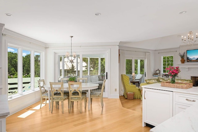 2255 French Creek Cir, Orono, MN 55391 - dining space featuring a chandelier, healthy amount of natural light, ornamental molding, light wood-type flooring, and recessed lighting