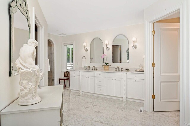 2255 French Creek Cir, Orono, MN 55391 - bathroom featuring marble look tiles and double vanity
