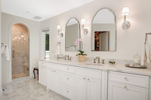 2255 French Creek Cir, Orono, MN 55391 - full bathroom with double vanity, a shower stall, and marble finish floors