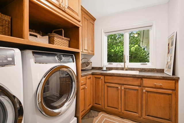 2255 French Creek Cir, Orono, MN 55391 - laundry room featuring washer and clothes dryer, cabinet space, and light tile patterned flooring
