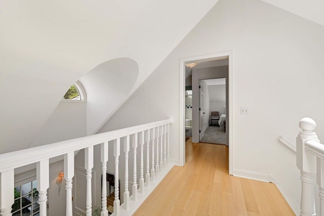 2255 French Creek Cir, Orono, MN 55391 - corridor with vaulted ceiling, an upstairs landing, and light wood-type flooring