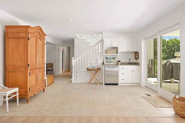 2255 French Creek Cir, Orono, MN 55391 - kitchen with refrigerator, light stone countertops, recessed lighting, and white cabinetry