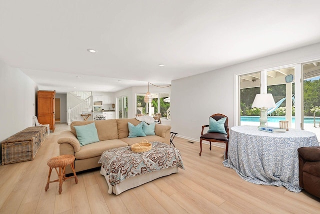 2255 French Creek Cir, Orono, MN 55391 - living area with light wood-type flooring, stairs, and recessed lighting
