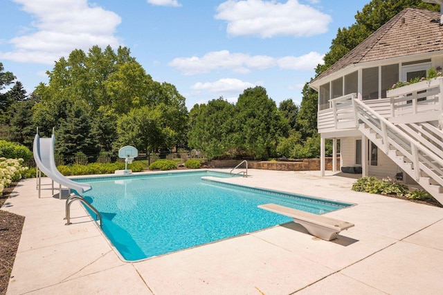 2255 French Creek Cir, Orono, MN 55391 - swimming pool featuring a water slide, a sunroom, a patio, stairway, and a diving board