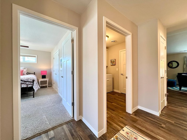 1180 Hewitt Blvd, Red Wing, MN 55066 - hall featuring dark wood-style floors and washer / dryer