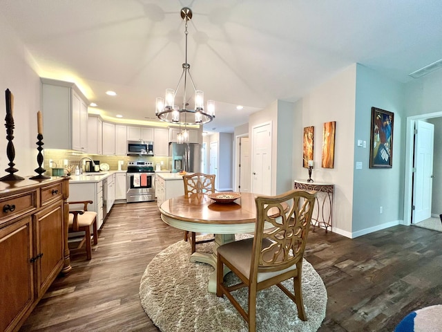 1180 Hewitt Blvd, Red Wing, MN 55066 - dining area with a chandelier, dark wood-style floors, and recessed lighting