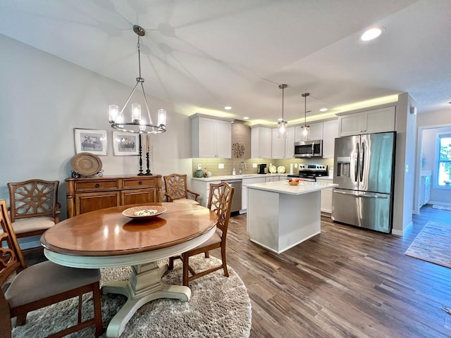 1180 Hewitt Blvd, Red Wing, MN 55066 - dining space featuring recessed lighting, dark wood-style floors, and a chandelier