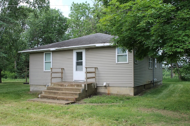25394 370th St, Browerville, MN 56438 - rear view of property featuring a yard and roof with shingles