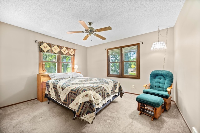 70190 218th St, Dassel, MN 55325 - carpeted bedroom with multiple windows, a textured ceiling, and a ceiling fan