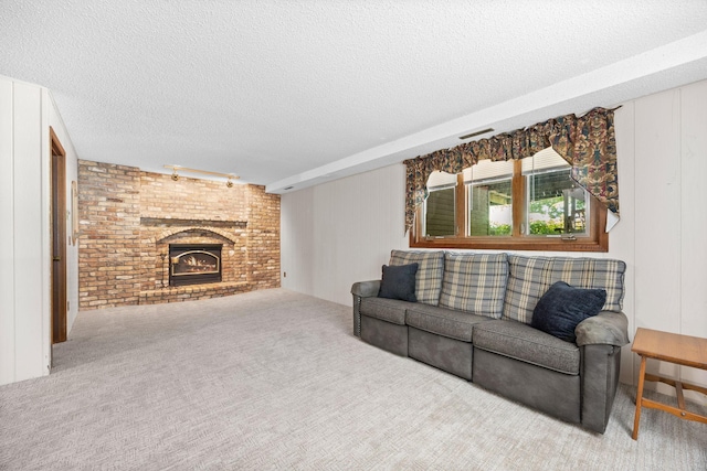 70190 218th St, Dassel, MN 55325 - carpeted living room with a textured ceiling and a fireplace