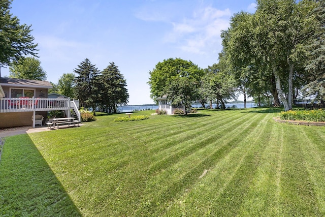 70190 218th St, Dassel, MN 55325 - view of grassy yard featuring a deck with water view