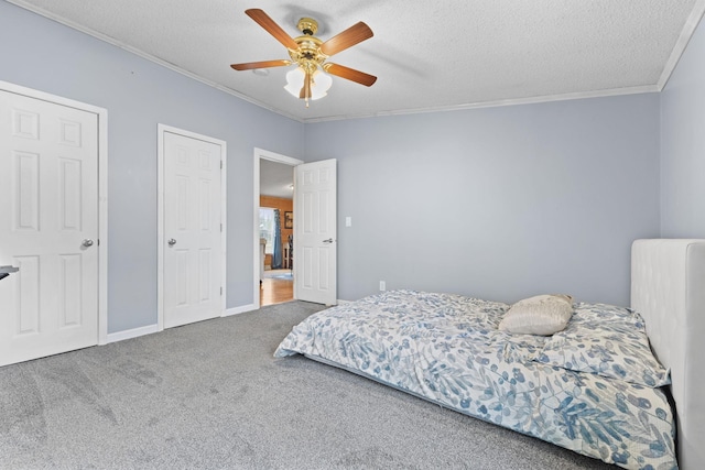 713 Center St, Chetek, WI 54728 - carpeted bedroom featuring ornamental molding, ceiling fan, and a textured ceiling