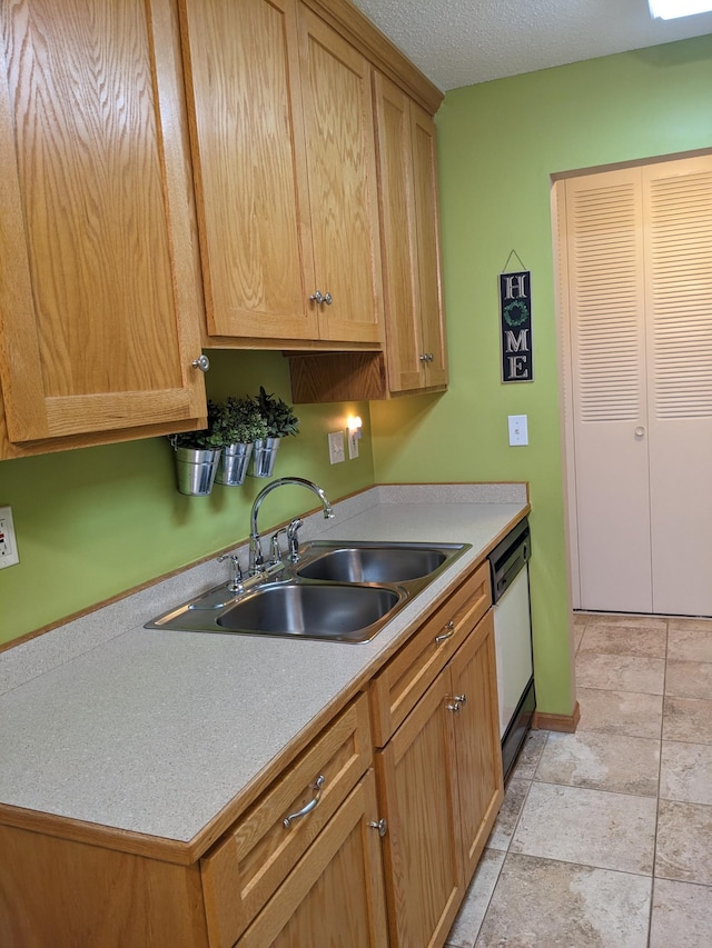 2800 Hillsboro Ave N Unit 113, New Hope, MN 55427 - kitchen with white dishwasher, light countertops, and a textured ceiling