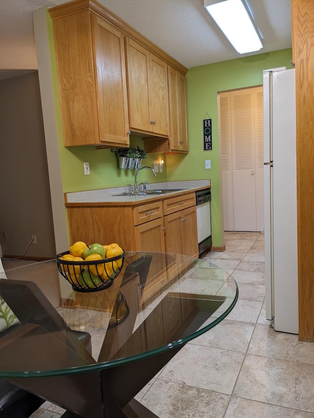 2800 Hillsboro Ave N Unit 113, New Hope, MN 55427 - kitchen featuring white appliances, light countertops, and a textured ceiling