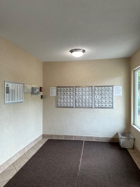 2800 Hillsboro Ave N Unit 113, New Hope, MN 55427 - empty room featuring mail area and tile patterned floors