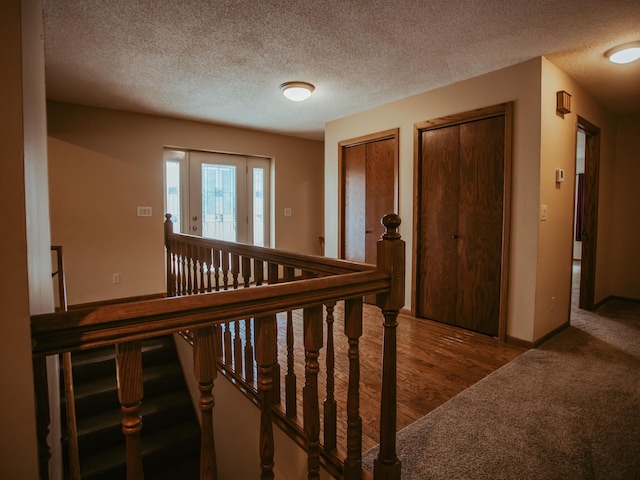 610 25th St SW, Austin, MN 55912 - corridor with a textured ceiling and carpet flooring
