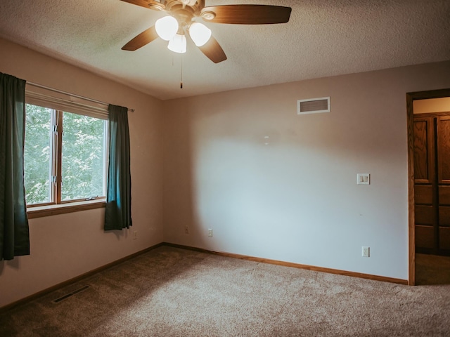 610 25th St SW, Austin, MN 55912 - carpeted spare room featuring a textured ceiling and ceiling fan