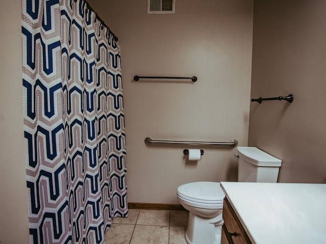 610 25th St SW, Austin, MN 55912 - full bath featuring vanity, tile patterned floors, and a shower with shower curtain
