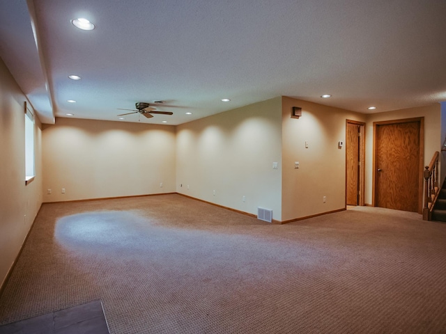 610 25th St SW, Austin, MN 55912 - carpeted spare room with a ceiling fan, recessed lighting, and stairs