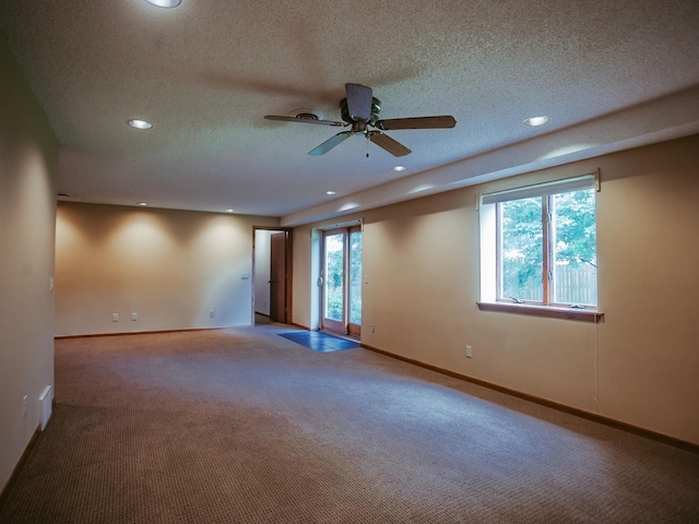 610 25th St SW, Austin, MN 55912 - unfurnished room featuring healthy amount of natural light, carpet floors, ceiling fan, recessed lighting, and a textured ceiling