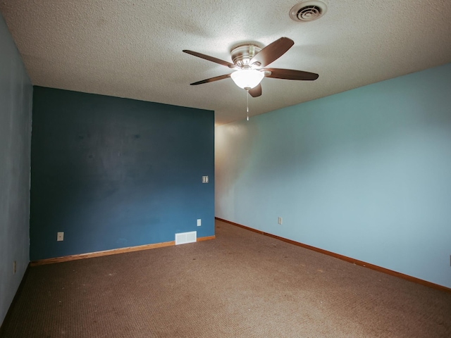 610 25th St SW, Austin, MN 55912 - spare room featuring ceiling fan, carpet floors, and a textured ceiling