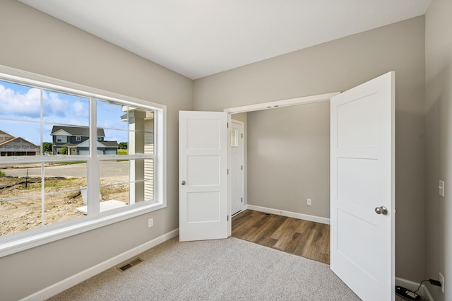 2627 Arbor Dr, Buffalo, MN 55313 - unfurnished bedroom featuring carpet floors and baseboards