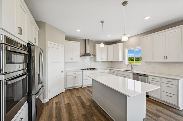 2627 Arbor Dr, Buffalo, MN 55313 - kitchen featuring wall chimney exhaust hood, stainless steel appliances, dark wood-type flooring, tasteful backsplash, and white cabinets