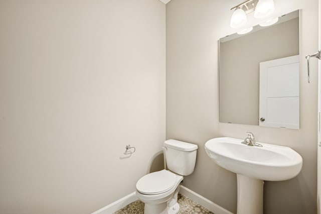 2627 Arbor Dr, Buffalo, MN 55313 - half bathroom featuring baseboards and toilet