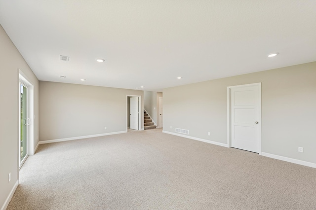 2627 Arbor Dr, Buffalo, MN 55313 - spare room with stairs, recessed lighting, light colored carpet, and plenty of natural light