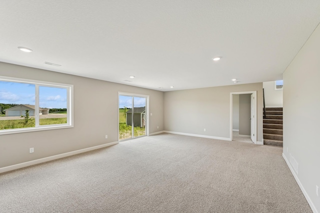 2627 Arbor Dr, Buffalo, MN 55313 - empty room with light colored carpet, stairway, and recessed lighting