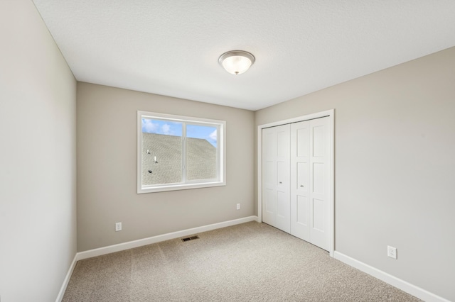 2627 Arbor Dr, Buffalo, MN 55313 - unfurnished bedroom featuring carpet flooring and a closet