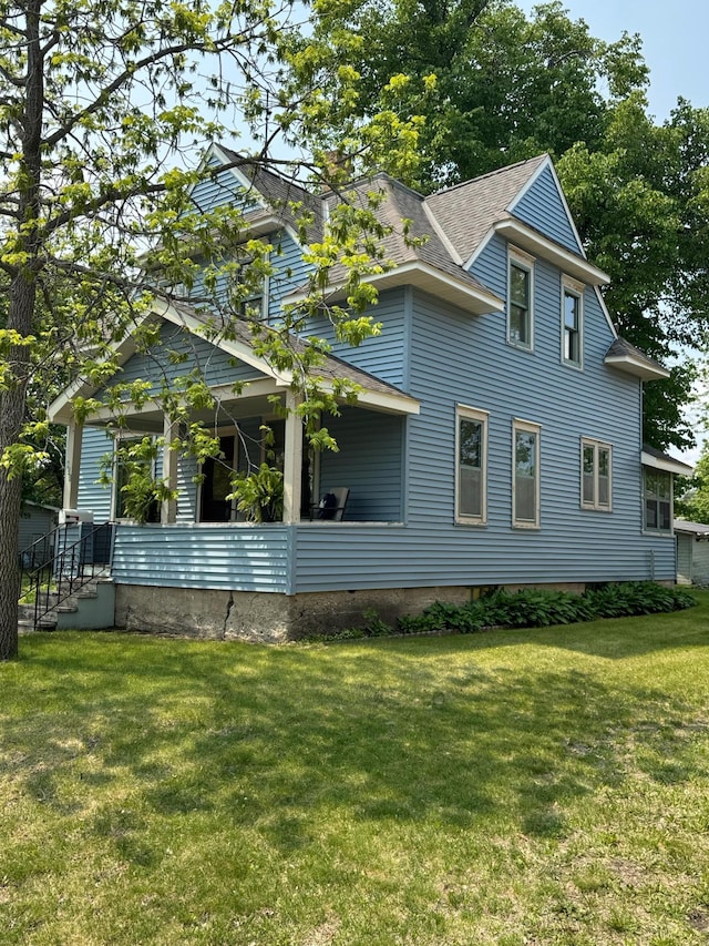 431 19 1/2 Ave N, Saint Cloud, MN 56303 - view of property exterior with a lawn and a shingled roof