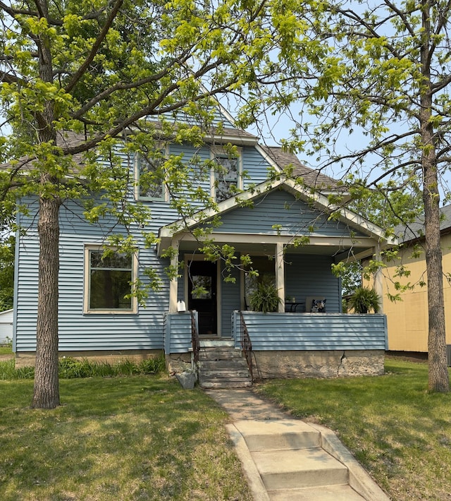 431 19 1/2 Ave N, Saint Cloud, MN 56303 - view of front of house with covered porch and a front yard