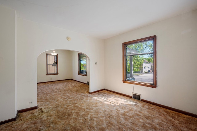 431 19 1/2 Ave N, Saint Cloud, MN 56303 - carpeted spare room featuring arched walkways, healthy amount of natural light, and a smoke detector