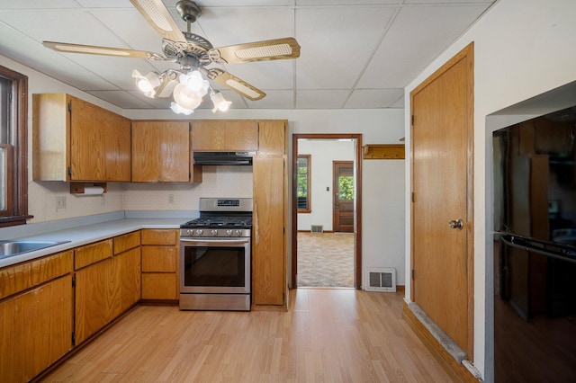 431 19 1/2 Ave N, Saint Cloud, MN 56303 - kitchen with gas stove, under cabinet range hood, light wood-type flooring, light countertops, and a drop ceiling