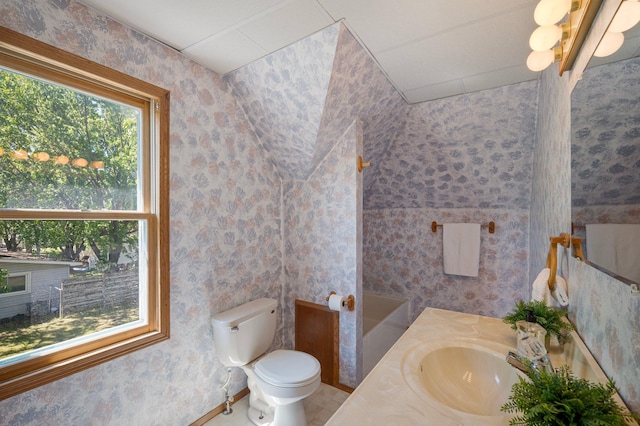 431 19 1/2 Ave N, Saint Cloud, MN 56303 - bathroom with wallpapered walls, a tub, vanity, and tile patterned flooring