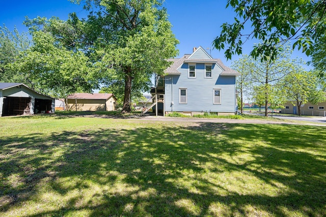 431 19 1/2 Ave N, Saint Cloud, MN 56303 - rear view of property featuring a yard and stairway