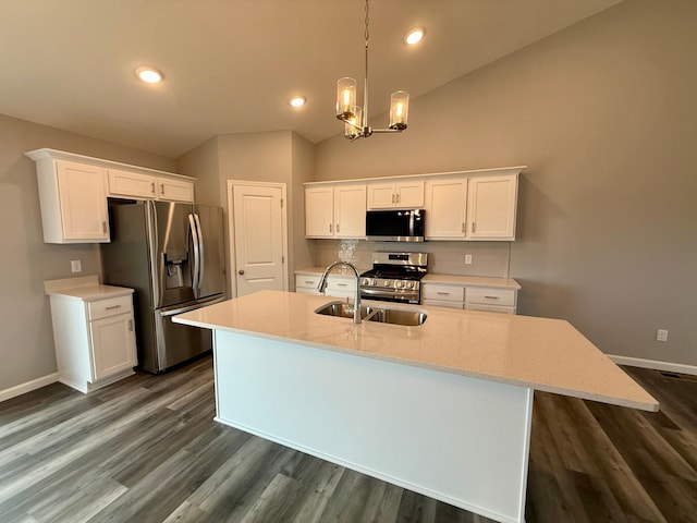 2811 Ivory Ave NE, Saint Michael, MN 55330 - kitchen with stainless steel appliances, white cabinetry, a chandelier, a center island with sink, and lofted ceiling