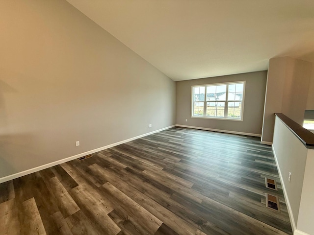 2811 Ivory Ave NE, Saint Michael, MN 55330 - unfurnished living room with dark wood-style floors and lofted ceiling