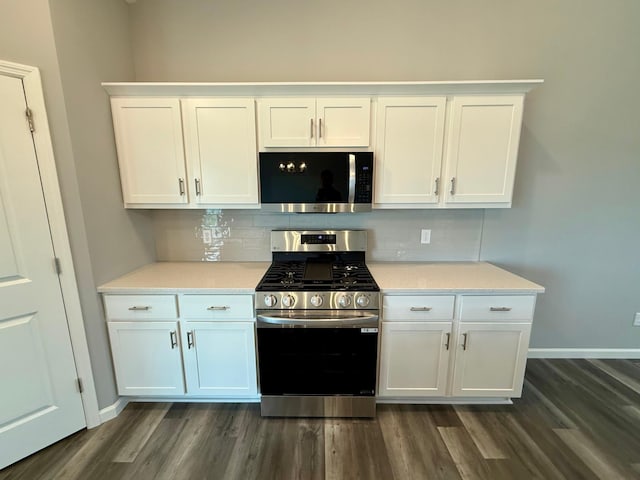 2811 Ivory Ave NE, Saint Michael, MN 55330 - kitchen with appliances with stainless steel finishes, decorative backsplash, and white cabinetry