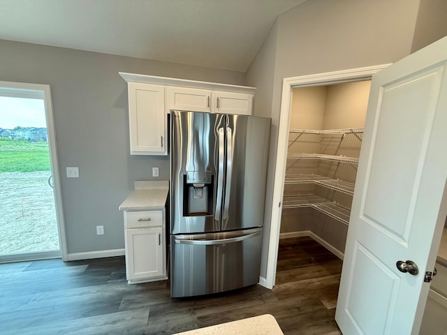 2811 Ivory Ave NE, Saint Michael, MN 55330 - kitchen with stainless steel refrigerator with ice dispenser, white cabinets, dark wood-style flooring, light countertops, and lofted ceiling