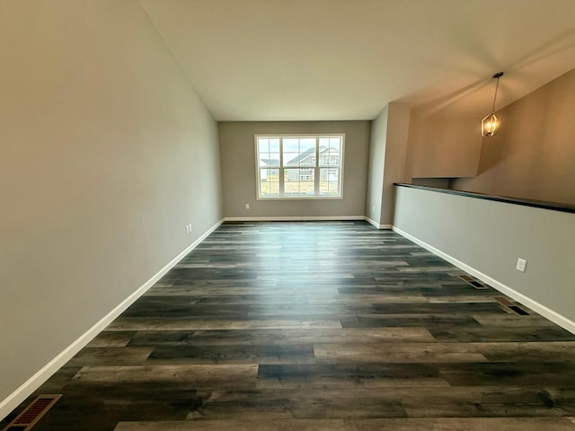 2811 Ivory Ave NE, Saint Michael, MN 55330 - spare room with dark wood finished floors and vaulted ceiling
