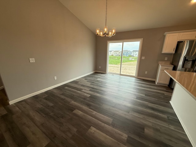 2811 Ivory Ave NE, Saint Michael, MN 55330 - unfurnished dining area featuring vaulted ceiling, a chandelier, and dark wood-style flooring