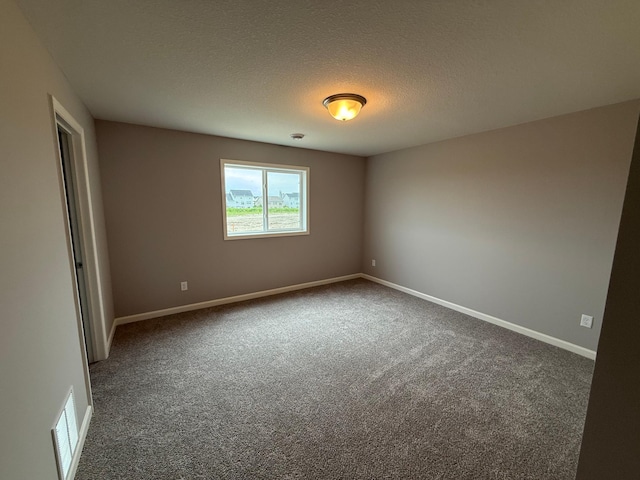 2811 Ivory Ave NE, Saint Michael, MN 55330 - carpeted spare room featuring baseboards and a textured ceiling