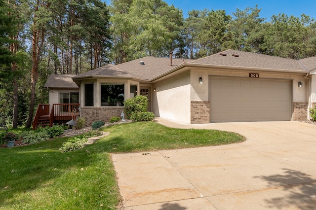508 Woodside Ct, Shakopee, MN 55379 - view of front of property featuring brick siding, an attached garage, a front lawn, and concrete driveway